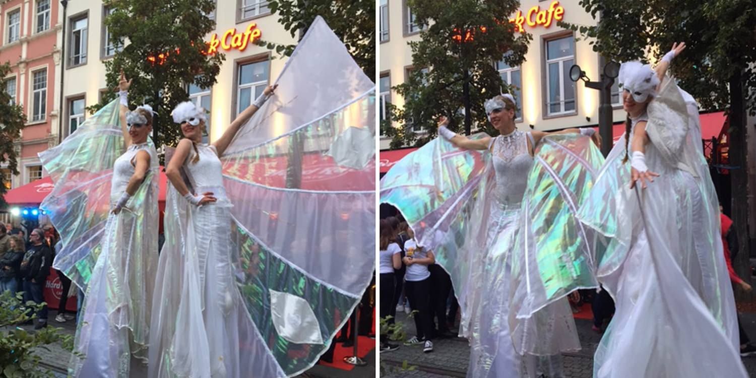 Elegant Stilt Walkers Entertain Guests At Hard Rock Café Brussels