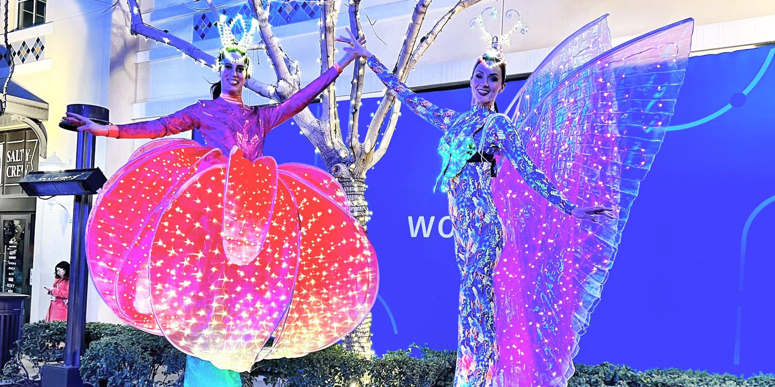 LED Flower and Butterfly Stilt Walkers Illuminate Las Vegas Promenade