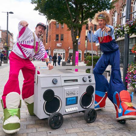 90s Theme Dancing Stilt Walkers