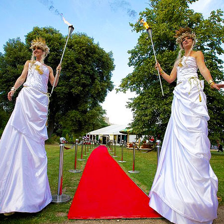 Torch Bearing Stilt Walkers