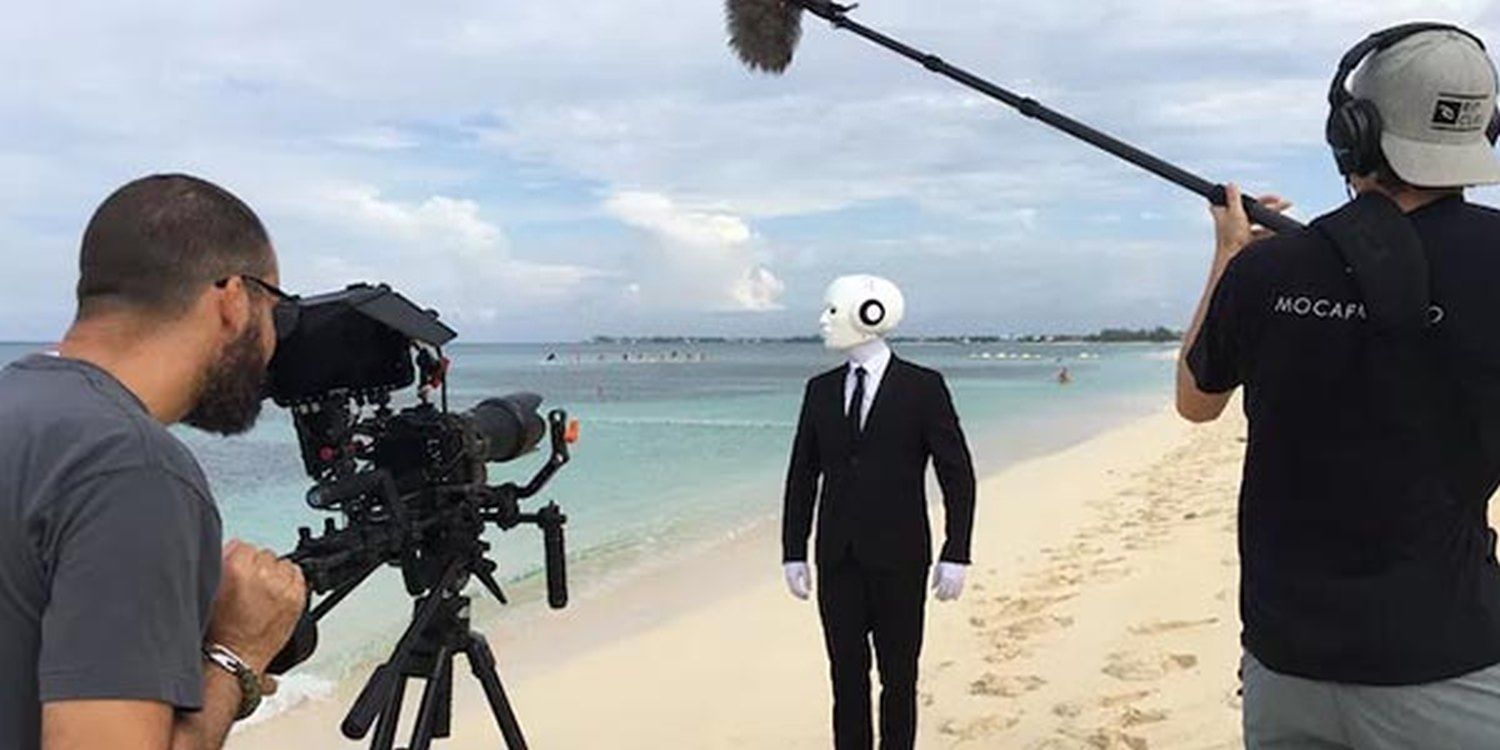 Real Life Humanoid Flies To Cayman Island For Video Shoot