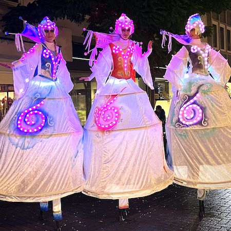 Luminous Stilt-Walking Act