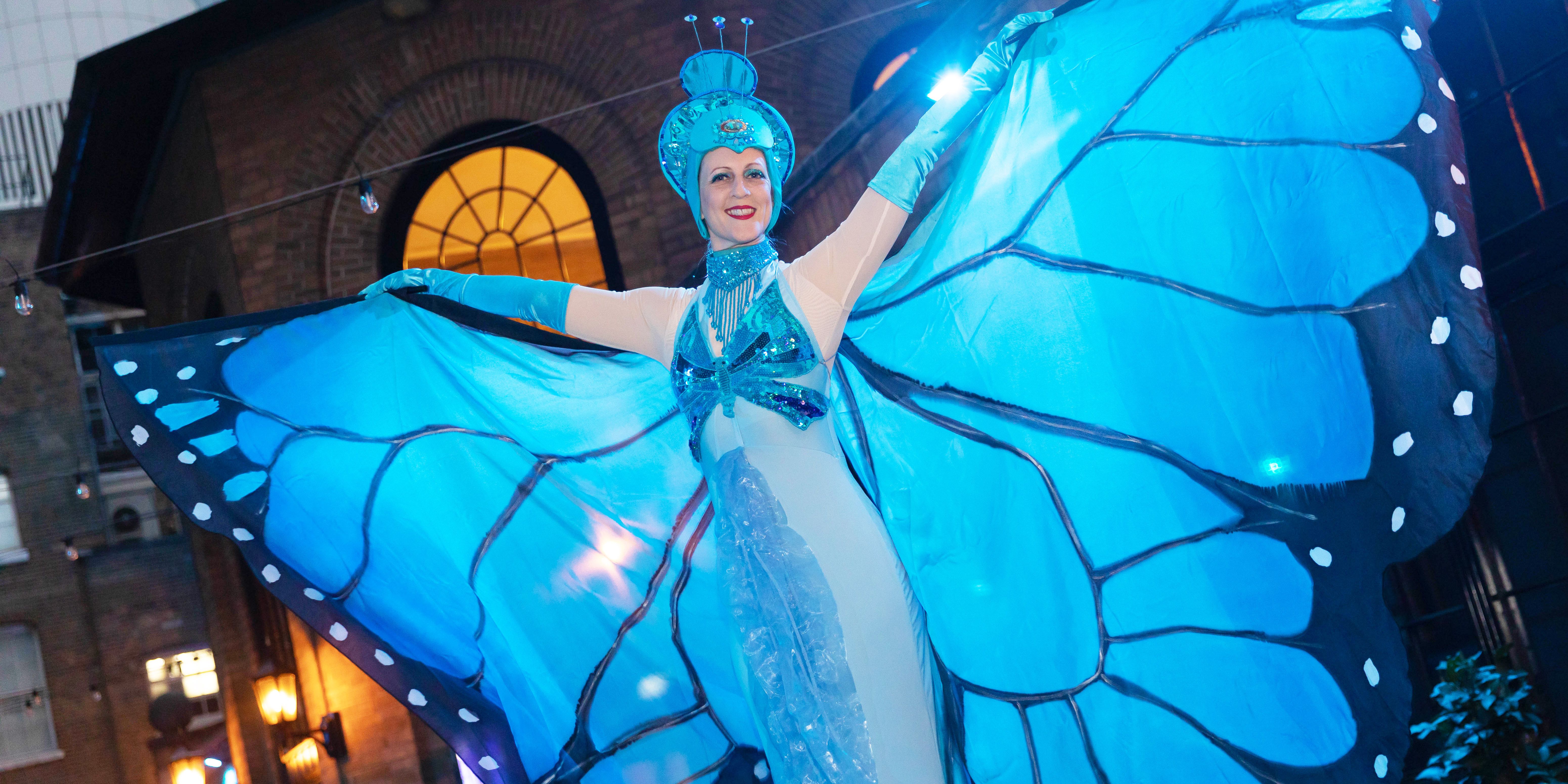 Butterfly Stilt Walkers Greet Arriving Guests at Magazine Awards Ceremony